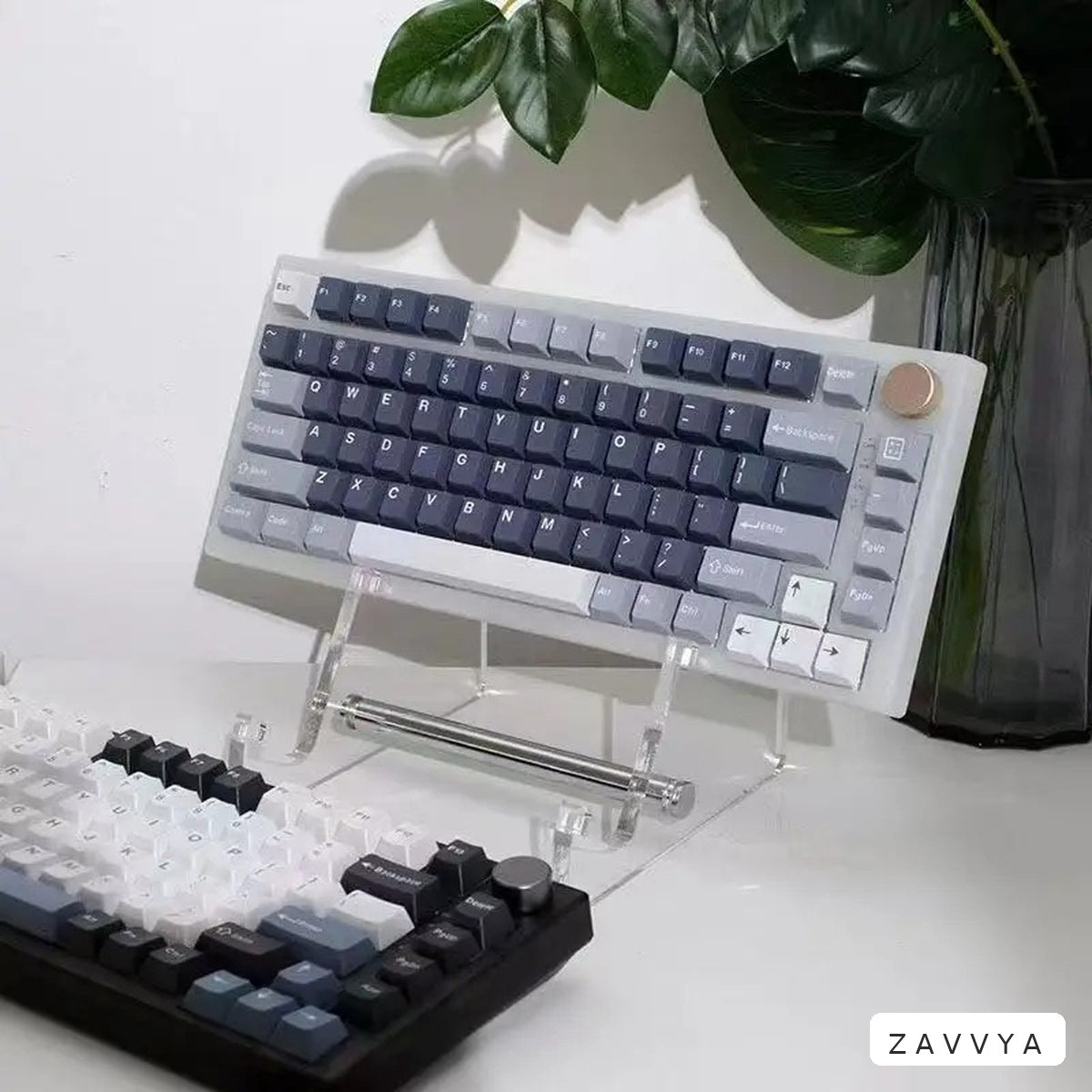 Clear acrylic keyboard stand in a desk setup