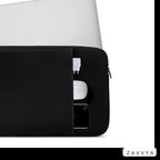 Black laptop sleeve in a relative-scale flat lay